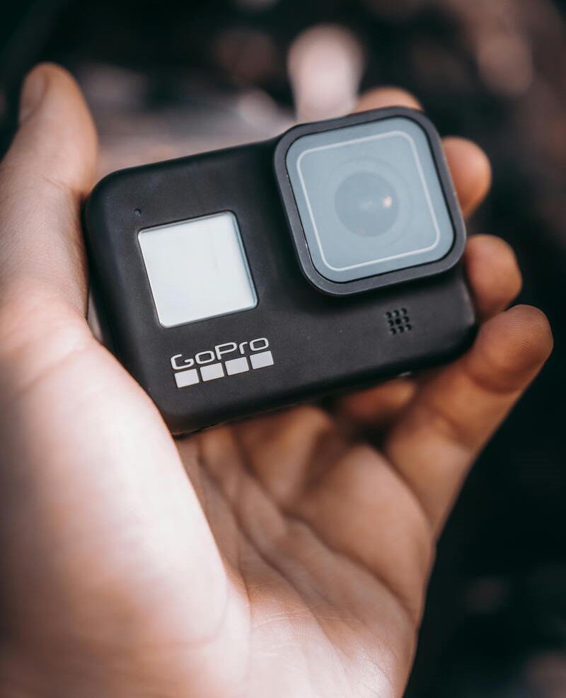 Picture of a hand holding a GoPro action camera on the website of 'The House Technology', specialists in action cameras and accessories for GoPro and Insta360.